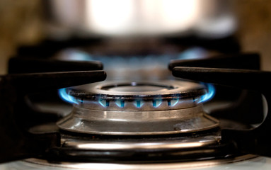 The stove. Gas burner in close-up.