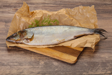 Salted herring over the wooden board