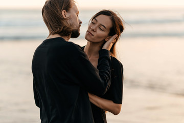 Young couple in love, Attractive man and woman enjoying romantic evening on sunset