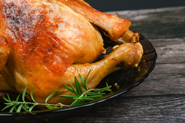 Baked turkey on wooden background