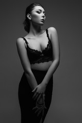 Fototapeta premium Gorgeous young woman dressed in black underwear