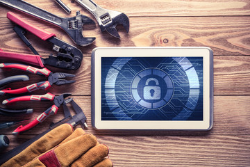 Web security and technology concept with tablet pc on wooden table © adam121