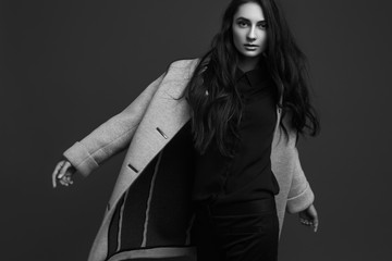 High fashion portrait of young elegant woman. Black and white image