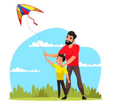 Father and son flying kite and having fun in park