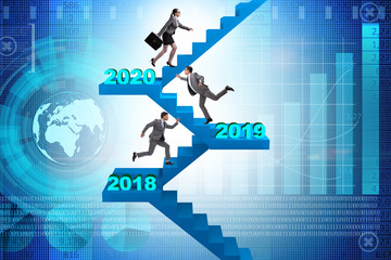 Businessman climbing stairs on yearly basis