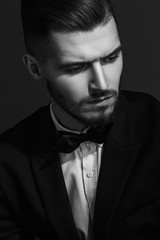 
Brutal portrait of a man in a classic suit, black and white photography