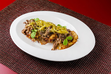 Roast beef, fried meat, meat dish with vegetables for lunch in a restaurant