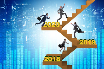 Businessman climbing stairs on yearly basis