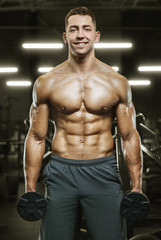 Obraz na płótnie Canvas Bodybuilder athletic man workout muscles exercise