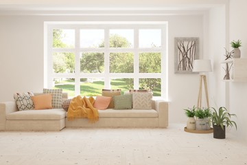 White living room with sofa and summer landscape in window. Scandinavian interior design. 3D illustration