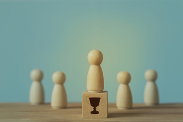 Successful business team leader concept: Businessman standing at the highest point on wooden block stand out from the crowd. depicts of career growth up or business success.