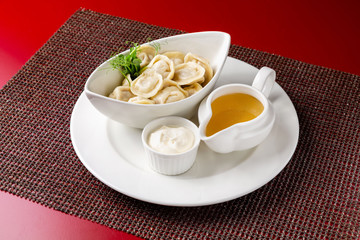 Dumplings, manti cooked dish in a restaurant