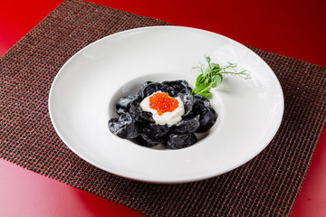 Dumplings, manti cooked dish in a restaurant