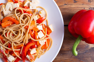 Vegan food; pasta with tofu and red peppers