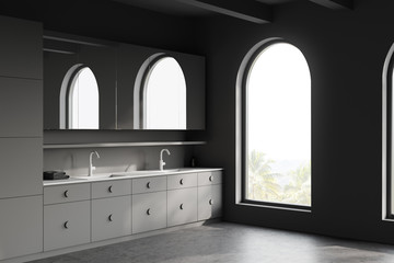 Arched grey bathroom corner with double sink