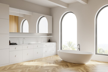 Fototapeta na wymiar Arched white bathroom corner with tub and sink