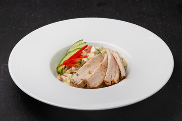 Vegetable and meat salad, classic salad for lunch in a restaurant