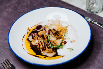 Scallop ceviche and foie gras with hazelnuts.