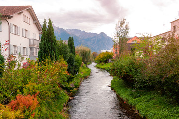 Fototapeta na wymiar A beautiful natural creek in suburban area of Vaduz, the capital city of Liechtenstein in Central Europe
