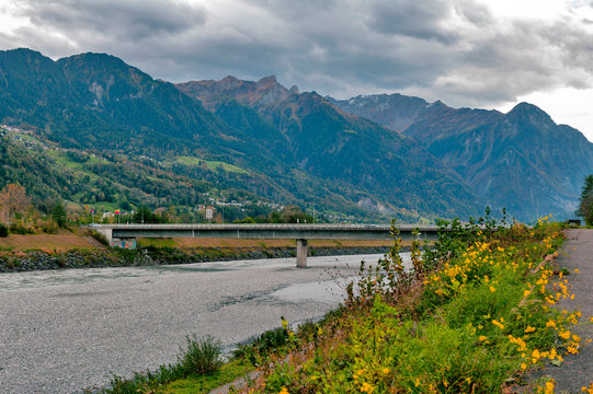 The river Rhine, a natural country border between municipalities of Vaduz in Liechtenstein and Sevelen in Switzerland