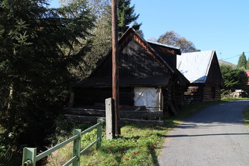 Fototapeta na wymiar Log cabins in Nizna Boca village and municipality in Liptovsky Mikulas district, central Slovakia