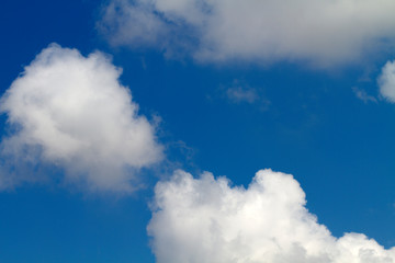 Naklejka na ściany i meble Blue sky with clouds close up