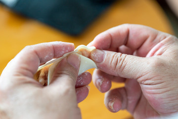 A chef is making dumplings