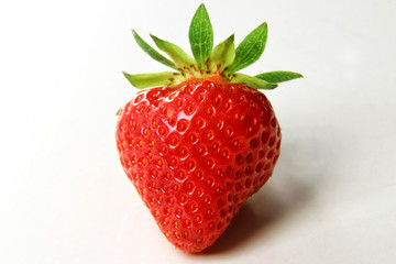 Red summer strawberries, fresh fruit on a white background
