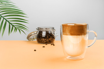 Glass mug with dalgon coffee. Refreshing Korean youth drink.