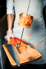 One piece, draped pineapple, is on the skewer.