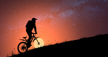 Silhouette of fairytale cyclist
