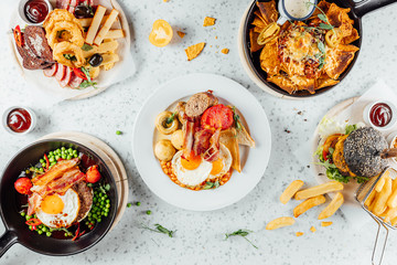 Top view on Pub food table, different foods on table,Flat lay meals at Irish pub