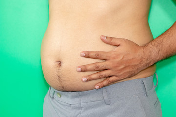 Men have a big belly and look fat. Obesity can cause many complications.