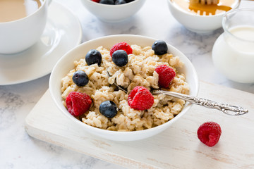 Oatmeal with berries for breakfast in a bowl