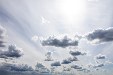 beautiful fluffy clouds in the light of morning sun