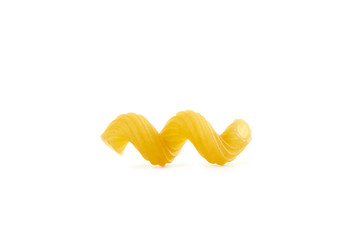 Italian raw dry pasta cellentani isolated on white background
