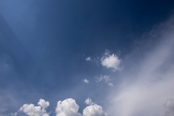 beautiful fluffy clouds in the light of morning sun