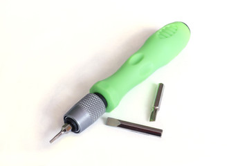 Pocket screwdriver with bits. Screwdriver with nozzles. Screwdriver Isolate.