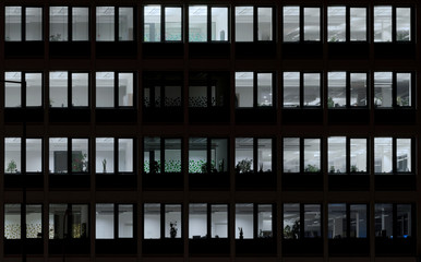 Open offices windows in the night with lights, Slovakia