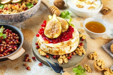 Camembert cheese with figs and honey. Selective focus. Close view