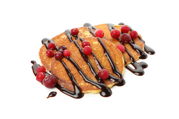Tasty pancakes with cranberry and sauce isolated on white background