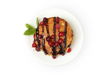 Tasty pancakes with cranberry and sauce isolated on white background