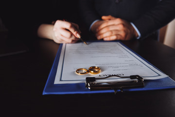 Marriage contract sign concept. Man and woman signing documents