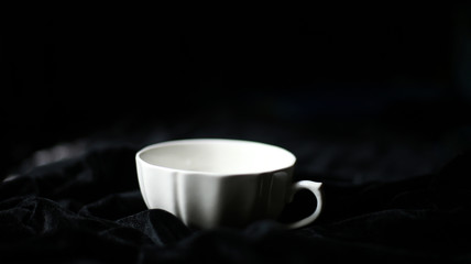 White colour soup cup in dark background