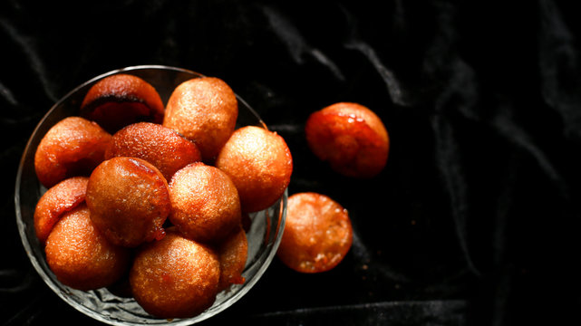 Homemade Kerala sweet snack, delicious Kerala snack unniyappam in dark background