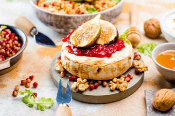 Camembert cheese with figs and honey. Selective focus. Close view