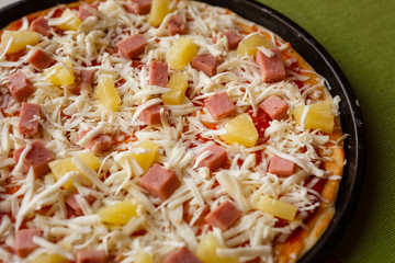 Raw pizza in a pan. Italian food cooking