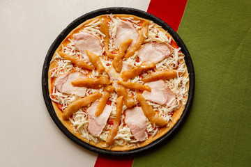 Raw pizza in a pan. Italian food cooking