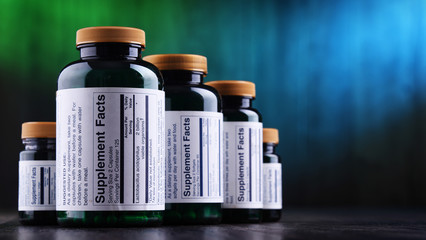 Composition with dietary supplement containers. Drug pills