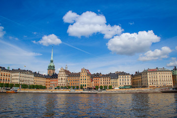 Fototapeta premium center of the Scandinavian capital of Stockholm with smooth bay water, promenade, yachts and houses. Scandinavian architecture of cities.